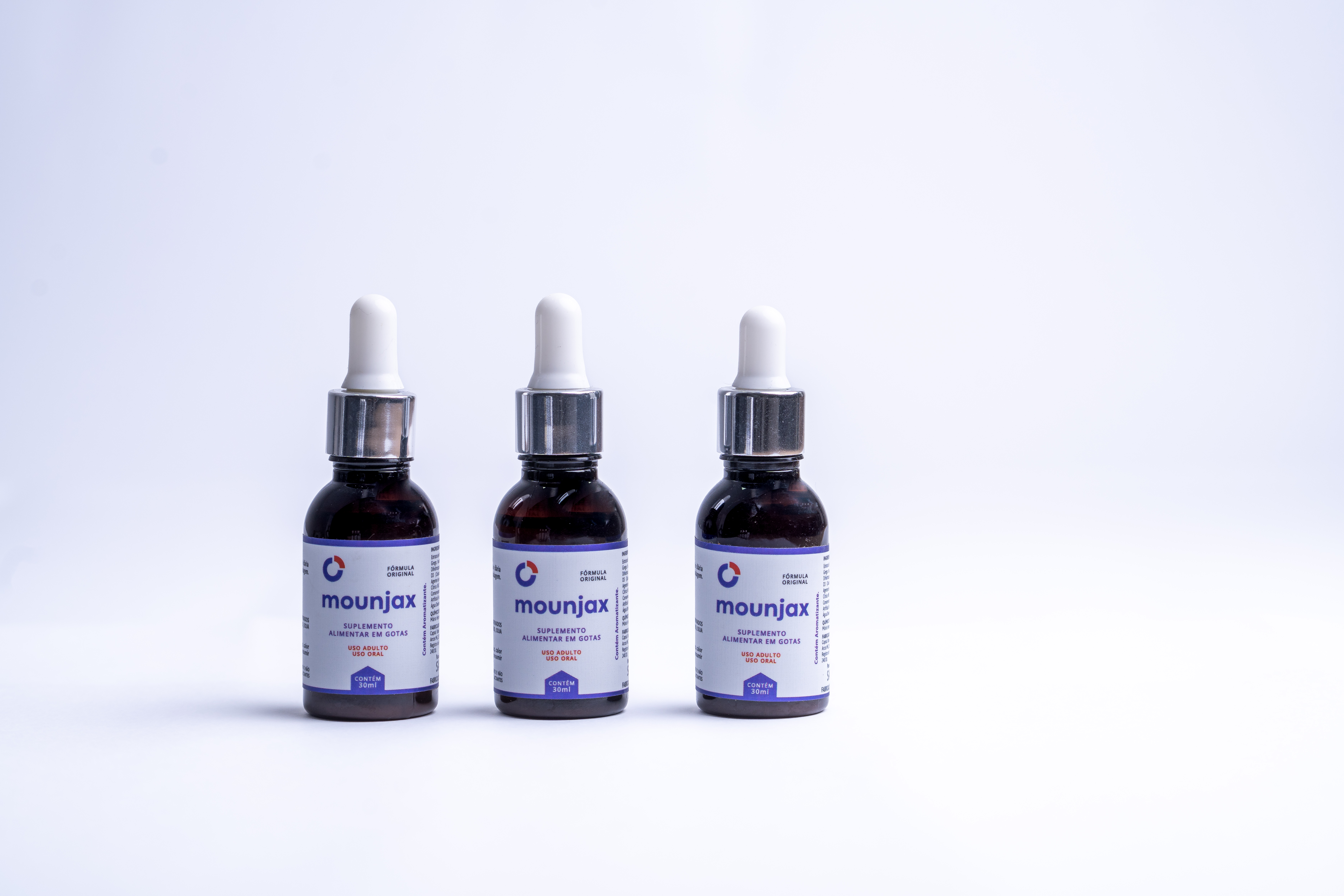 Frasco de Mounjax Gotas com embalagem conta-gotas de 30ml, exibindo o rótulo oficial roxo com detalhes em coral.